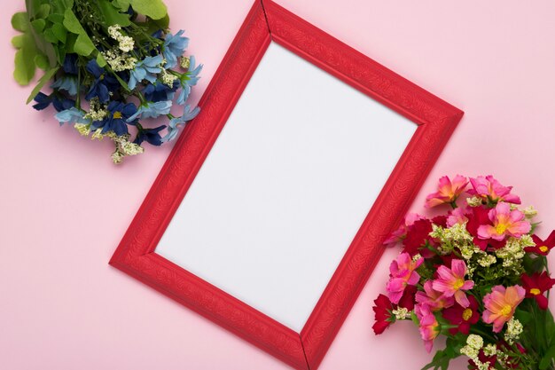 Blossom flowers with frame on table