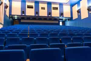 Free photo blue arm-chairs in cinema