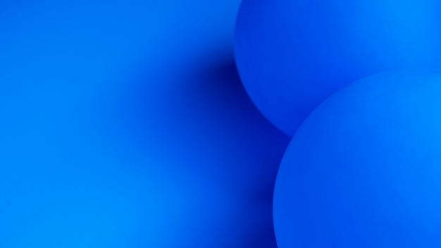 Free Photo blue balloons with copy space close-up