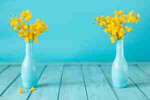 Free photo blue boards with two decorative vases