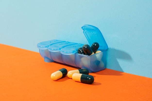 Free photo blue box with pills arrangement