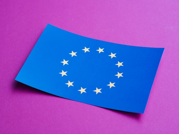 Free Photo blue card with european flag on purple background