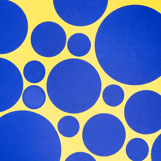 Blue circles of different sizes seamless yellow pattern