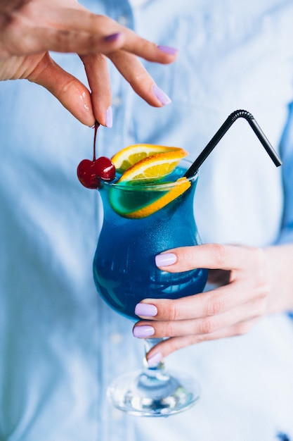 Free Photo blue cocktail with cherry