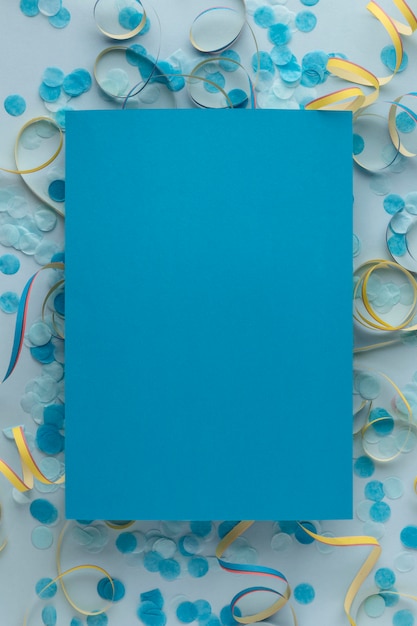 Blue copy space paper and confetti