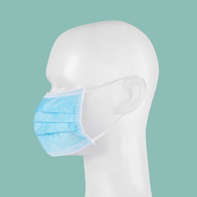 Blue disposable surgical face mask on a mannequin