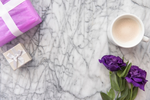 Blue flowers with coffee cup and gifts