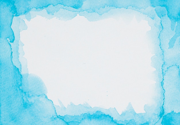 Free Photo blue frame of paints on white sheet