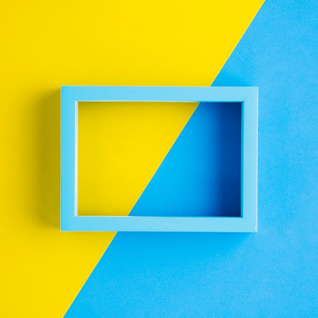 Free Photo blue frame with bicolor background