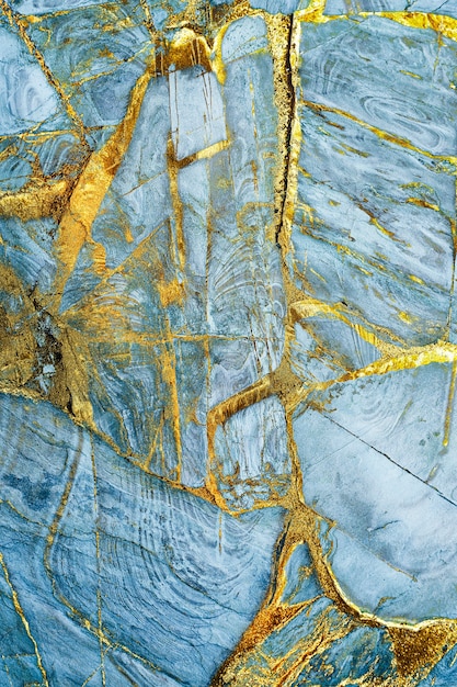 Blue and gold marble textured background