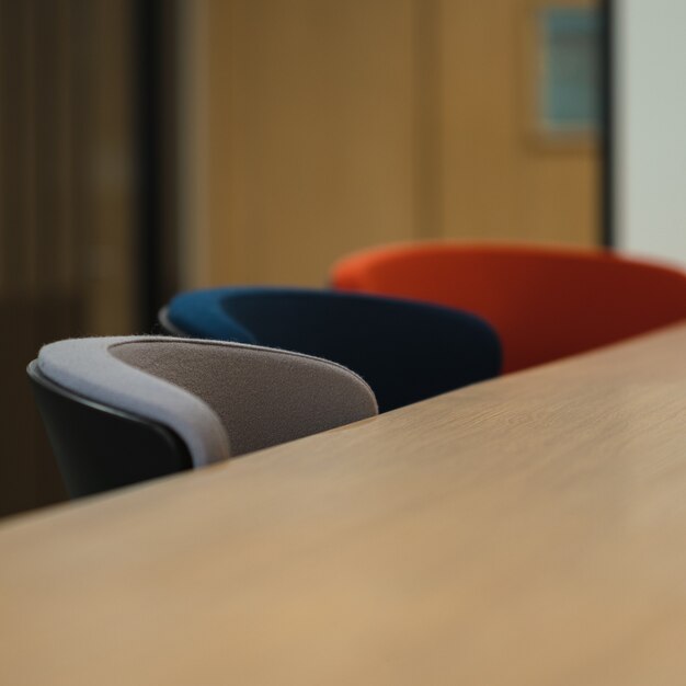 Blue and gray chairs beside brown wooden table