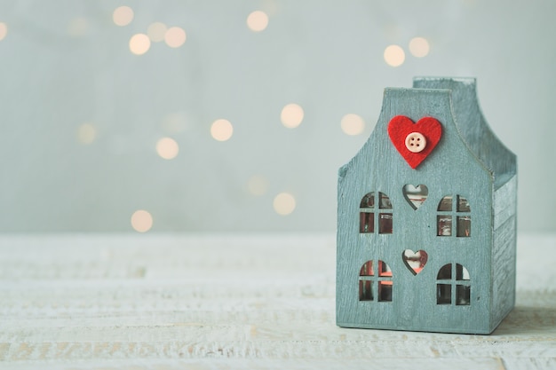 Blue house on a wooden table