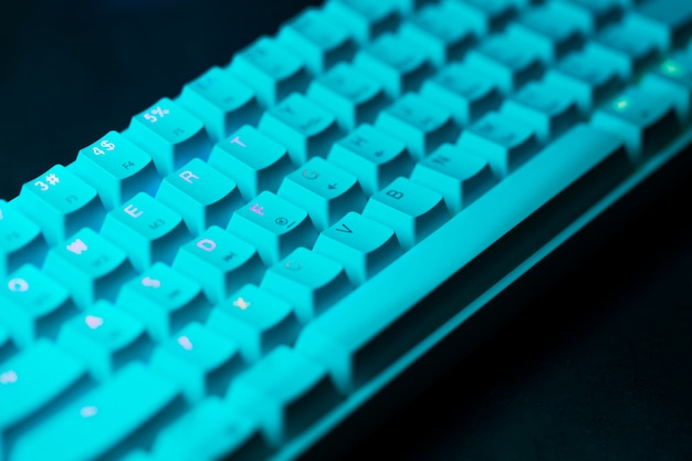 Blue keyboard with lights on desk