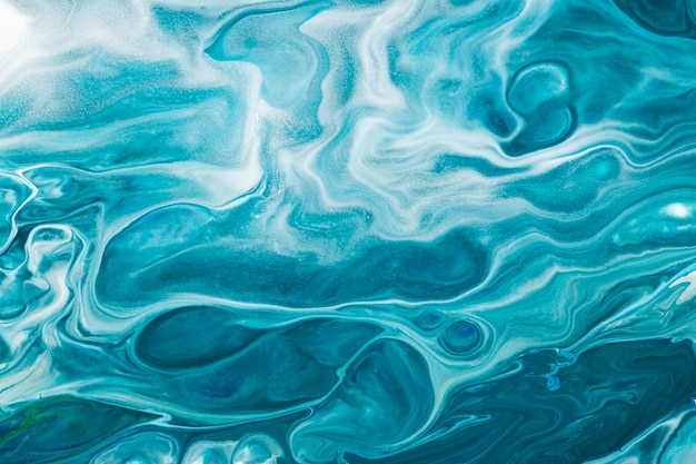 Free photo blue liquid marble background diy flowing texture experimental art