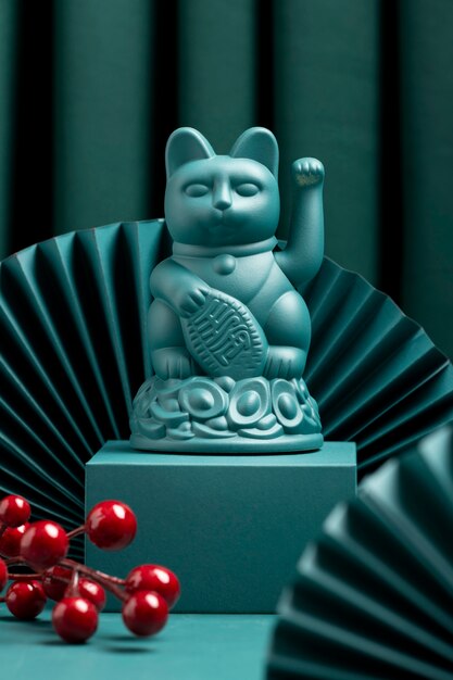 Blue lucky cat on pedestal superstition concept