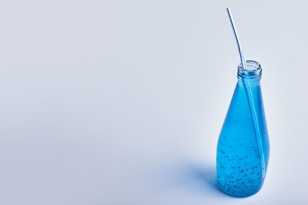 Blue mineral drink in a glass bottle.