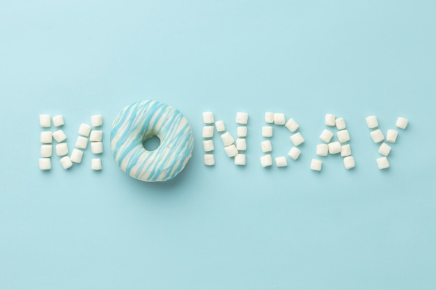 Free photo blue monday arrangement with doughnut