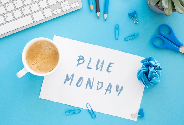 Free photo blue monday concept with cup of coffee