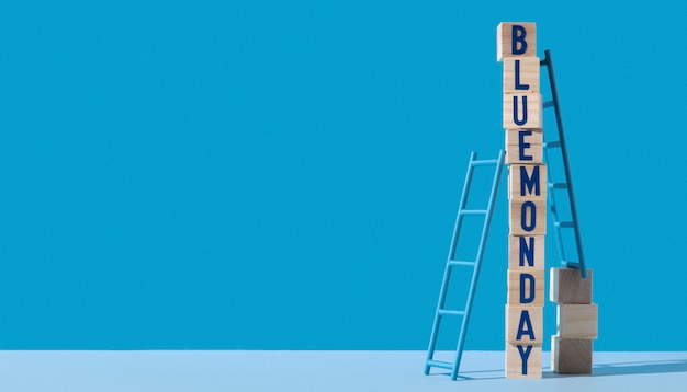 Free Photo blue monday with wooden cubes, ladders and copy space