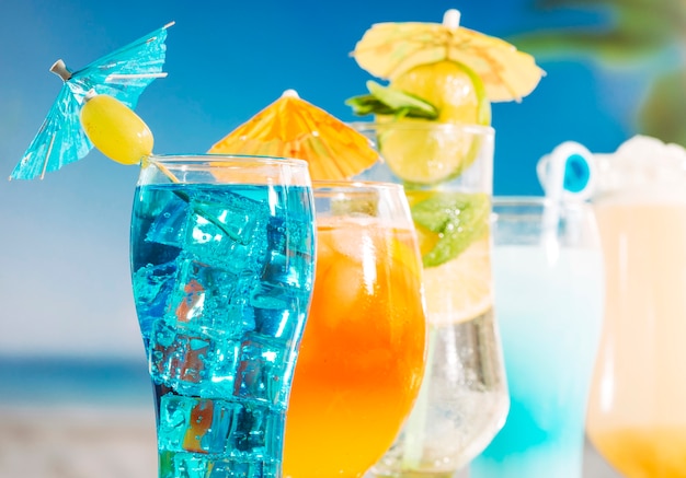 Free Photo blue orange drinks with olive sliced lime mint in glasses