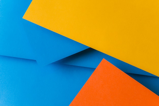 Free Photo blue; orange and yellow color papers for background