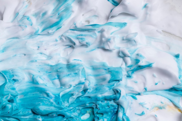 Free photo blue paint with smooth textured white foam background