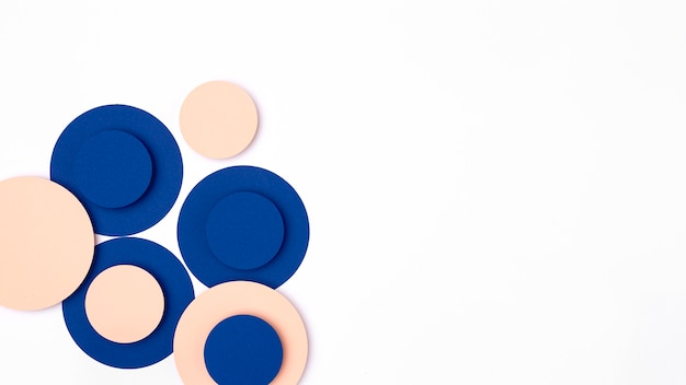 Free photo blue and peach paper circles