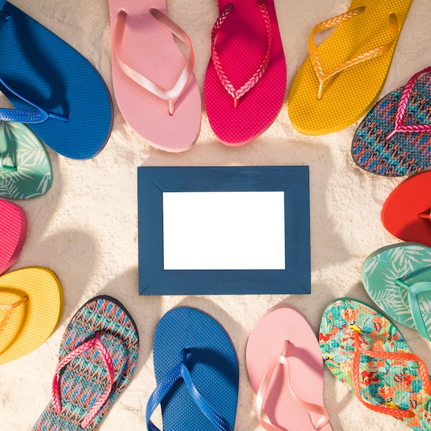 Blue photo frame circled by flip flops