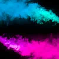 Free photo blue and pink smoke effect on black background