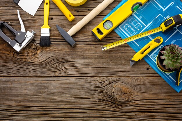 Blue print and repair kit on wooden background