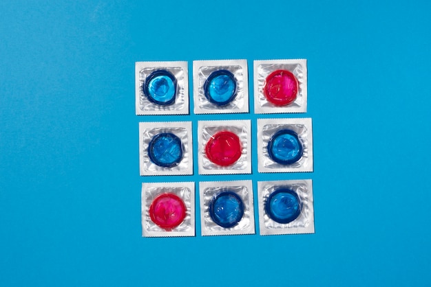 Blue and red condoms arrangement top view