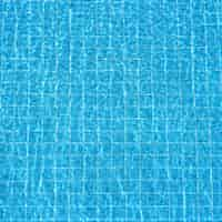 Free photo blue rippled water background in swimming pool