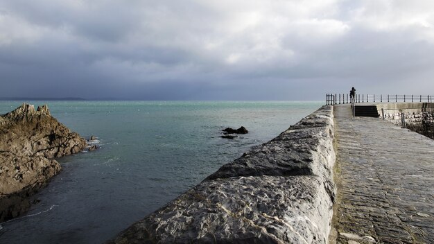 Blue sea and coastal area on a cloudy day