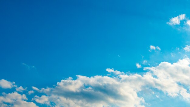 Blue sky with puffy white clouds