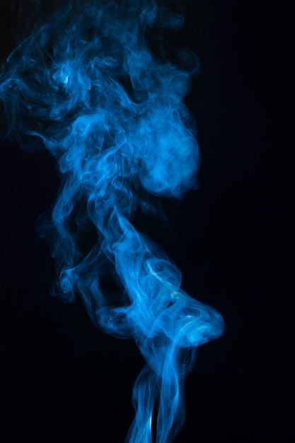 Free photo blue smoke overlay texture against black background