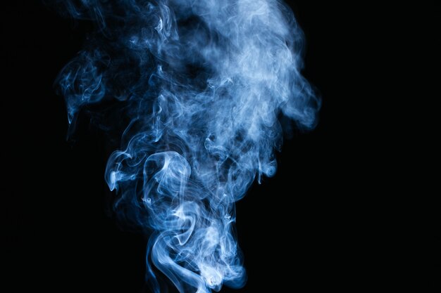 Blue smoke waves on black background