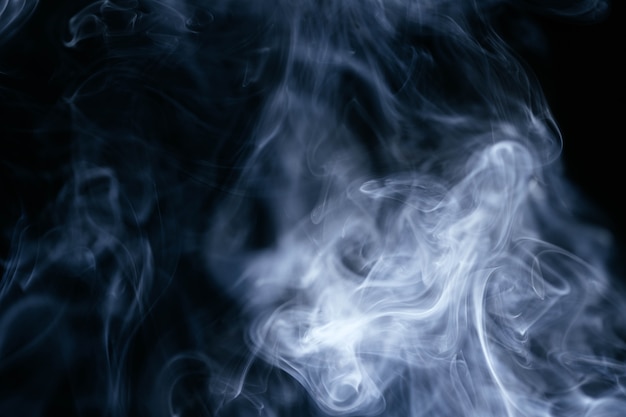 Blue smoke waves on black background