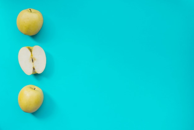 Blue surface with green apples