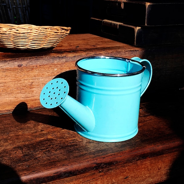 Free Photo blue watering can