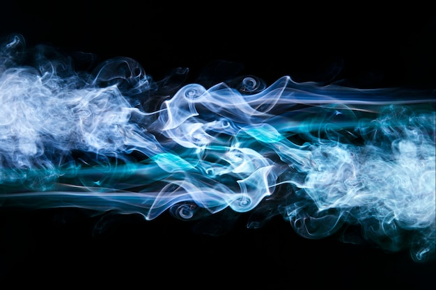 Free photo blue wavy smoke on black background