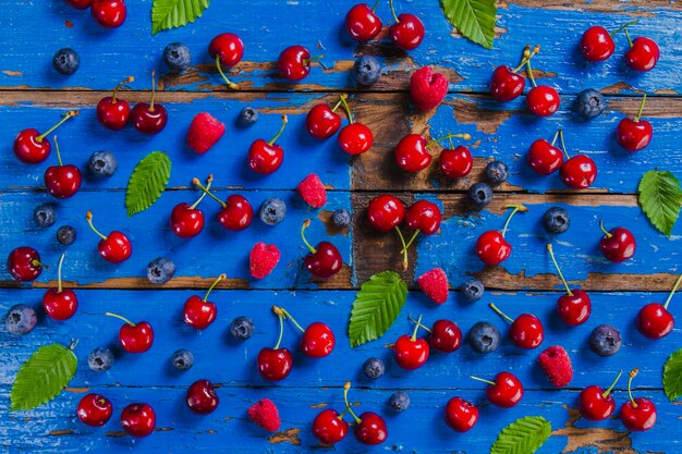 Blue wooden surface with colored fruits