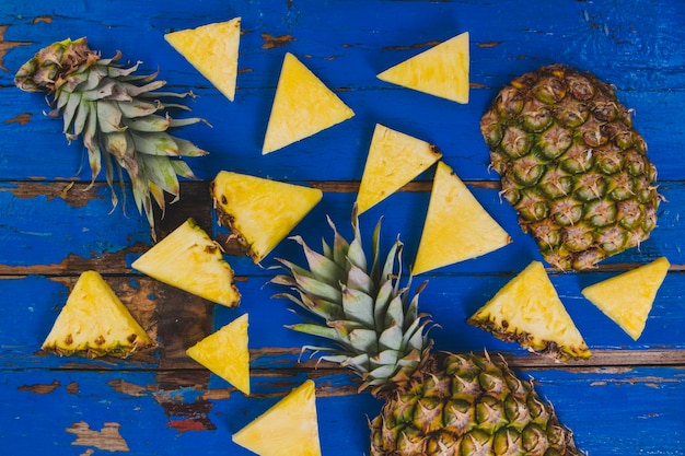 Blue wooden surface with pineapples