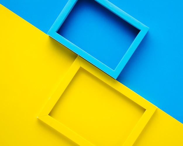 Free photo blue and yellow frames on bicolor background