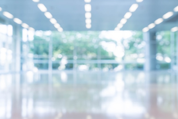 Free Photo blurred abstract background interior view looking out toward to empty office lobby and entrance doors and glass curtain wall with frame