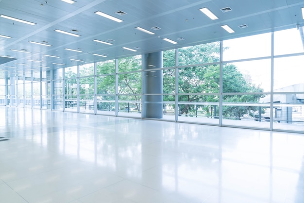 Free Photo blurred abstract background interior view looking out toward to empty office lobby and entrance doors and glass curtain wall with frame