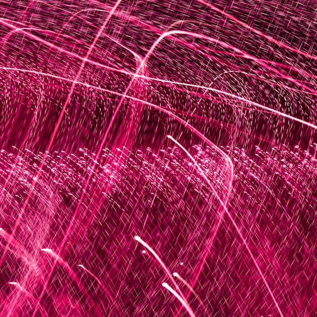 Free Photo blurred abstract pink light streak background