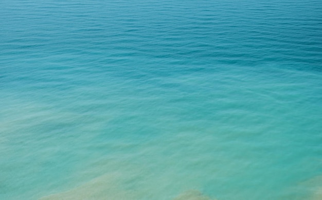 Free Photo blurred background of the sea in the midday heat from a bird's eye view hot summer vacation pastel colors and reflections on the water abstract blur poster or advertising banner