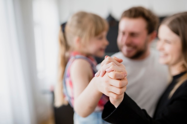 Free photo blurred family hugging each other