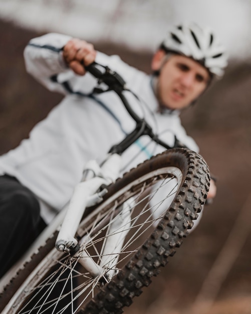 Free photo blurred man riding a bike