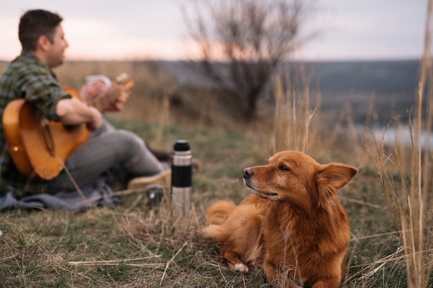 Blurred man with cute dog